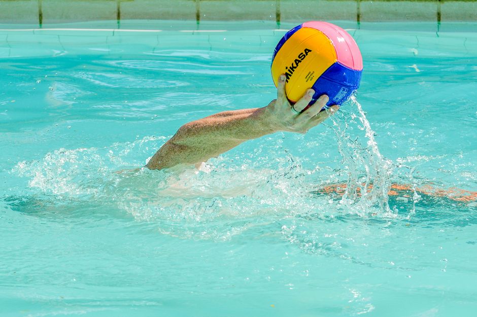 Dynamic water polo scene capturing the intensity of the game with vibrant colors and splashing water.