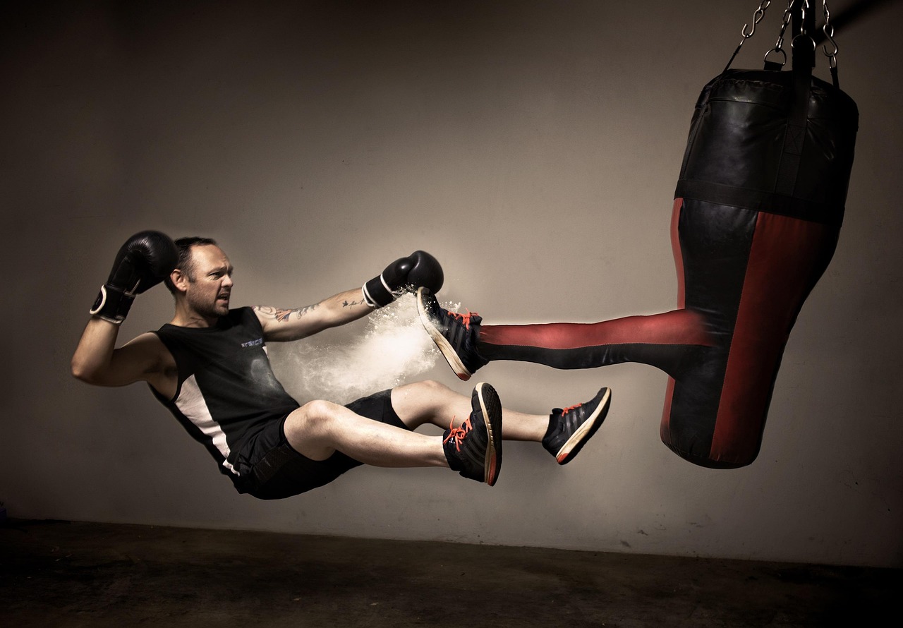 Kickboxing, boxing, boxing bag, boxing gloves, training, falling, dust, kicking, kick, wall, training room, training at home, sneakers, man, male, black gloves, boxer, fighting, sport, fighter, punch,