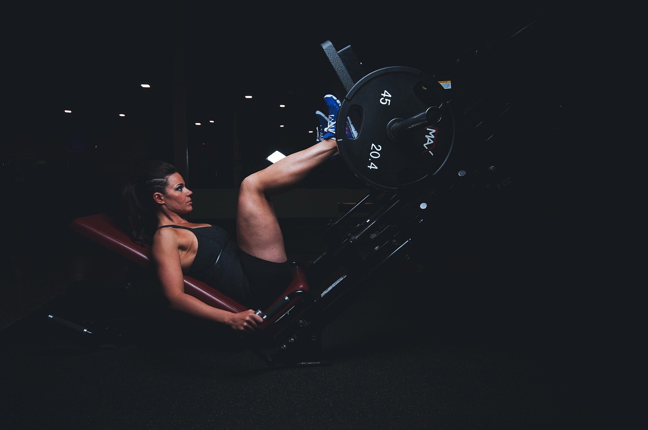 Adult, gym, athlete, dark, energy, exercise, exercise equipment, female, fit, fitness, girl, healthy, legs, muscles, plates, strength, strong, sweat, training, woman, workout, workout gear, push, blue