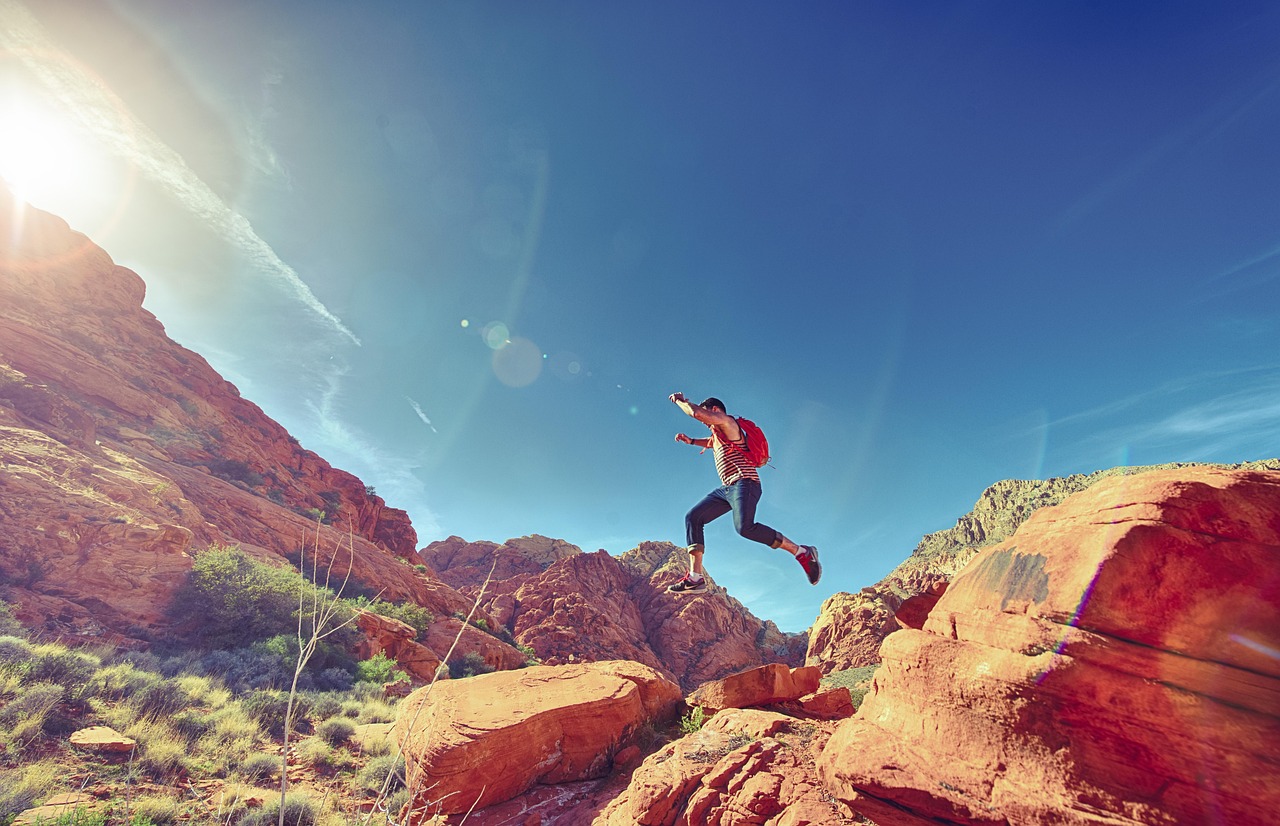 Man, jumping, mountains, rock formations, jump, joyful, nature, happy, athletic, outdoors, fun, sport, hiking, rocks, national, park, sunlight, action, active