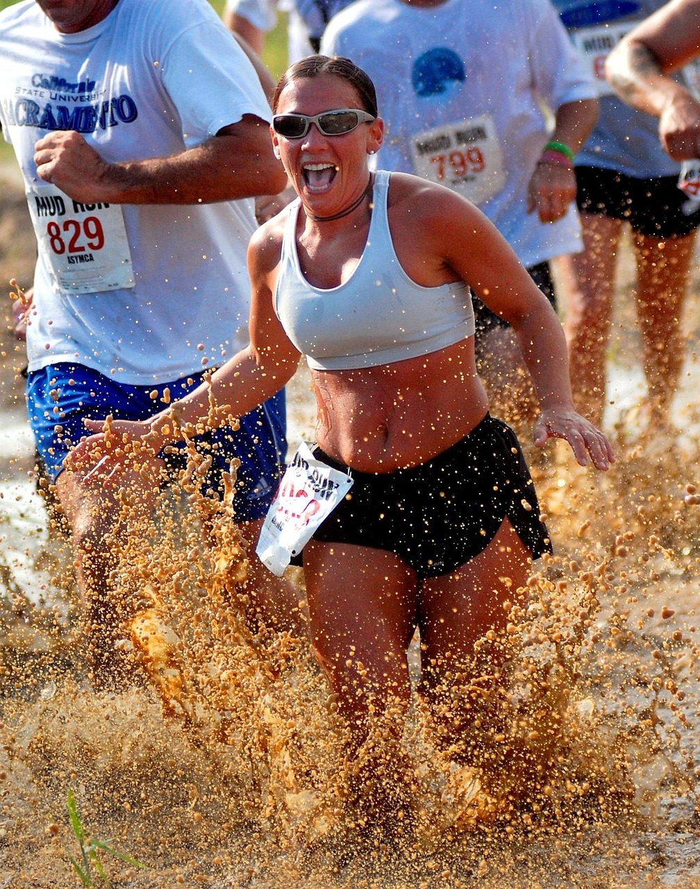 Woman, men, women, running, outside, mud, splashing, race, competition, plants, summer, spring, brown running, nature, brown run