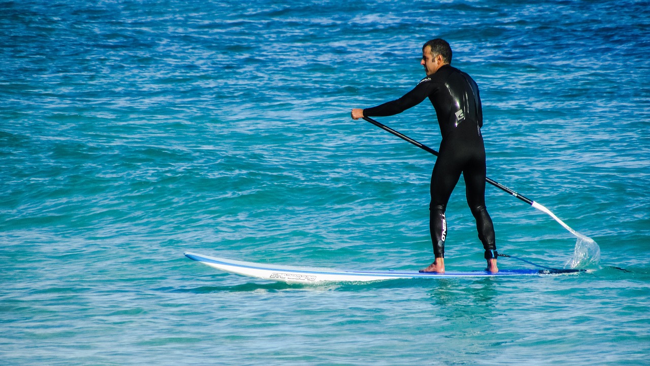 Paddleboarding, sport, paddle, board, stand, sea, lifestyle, beach, outdoor, fun, fitness, nature, surfer, man, athlete, activity, equipment, sport equipment, blue fitness, blue workout, blue sports, 