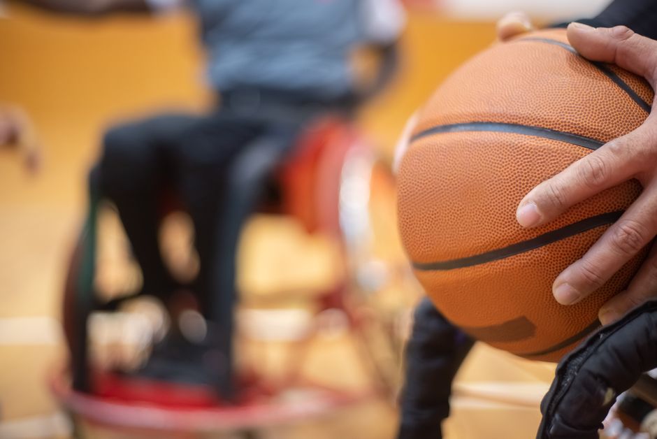 Dynamic close-up of a wheelchair basketball game highlighting player interaction.