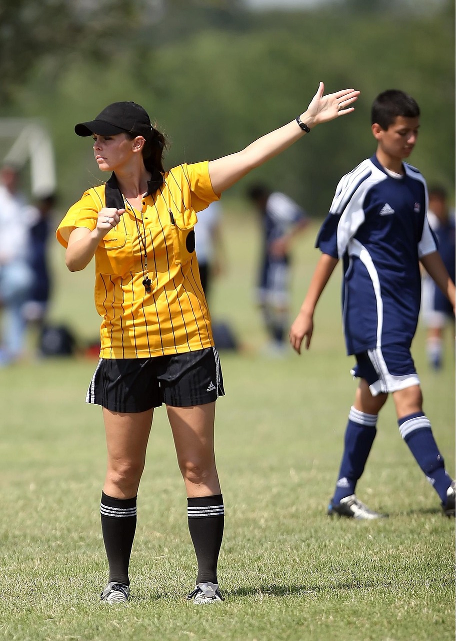 Soccer, referee, female, football, sport, game, match, whistle, signal, competition, field, judge, yellow, outdoors, ref, penalty, referee, referee, referee, referee, referee, whistle, whistle, whistl