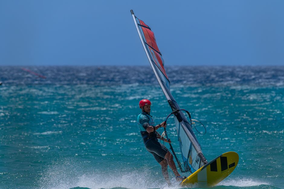 A thrilling shot of a windsurfer enjoying the ocean in Canarias, España. Vibrant action capture.