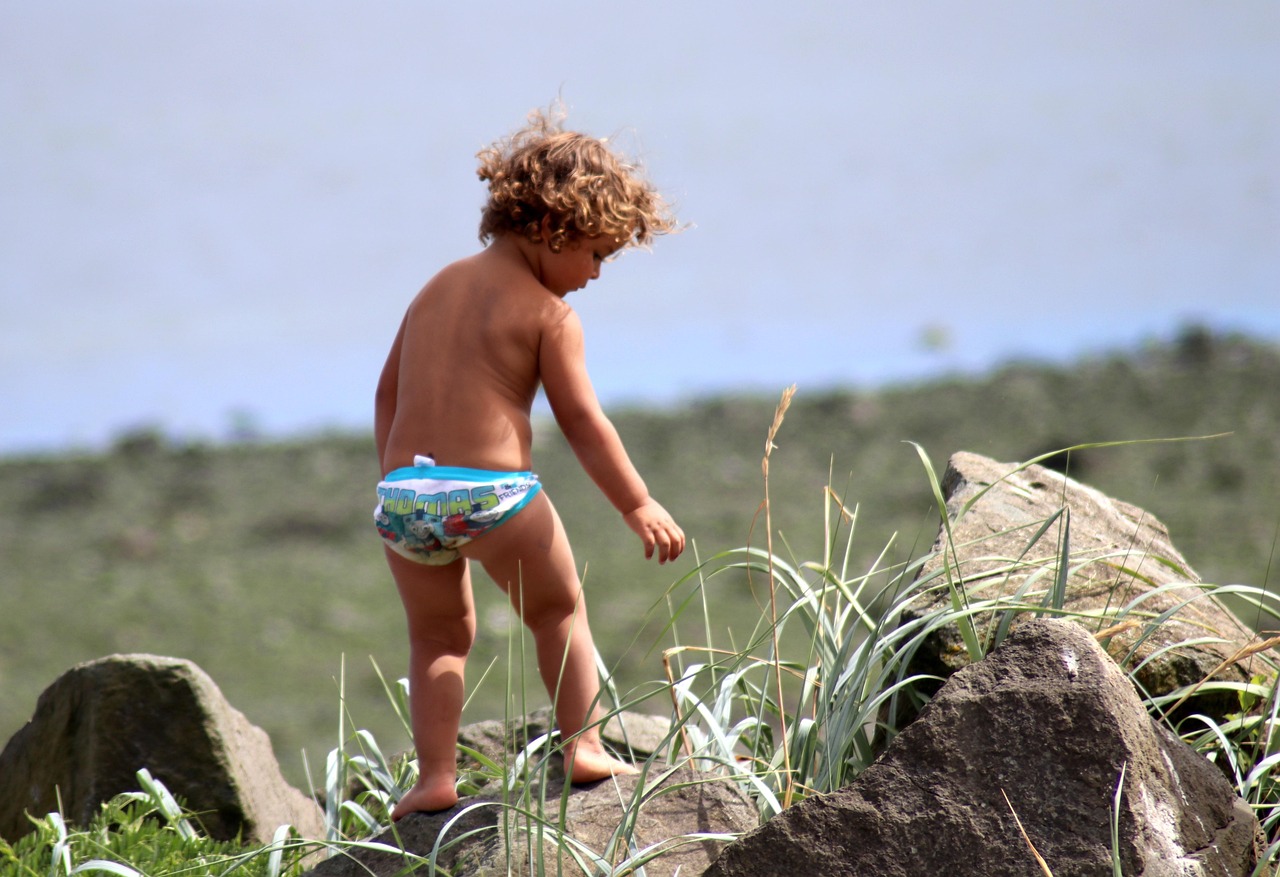 Beach, baby, child, childhood, fun, boy, play, climbing, rocks, nature, tan, cute, kid, people